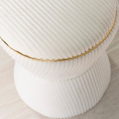 Kora – pouf in velluto a clessidra con profilo dorato